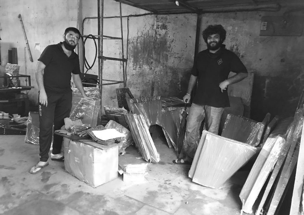 Black and white photo of the fabricator's workshop with folded sheet-metal panels