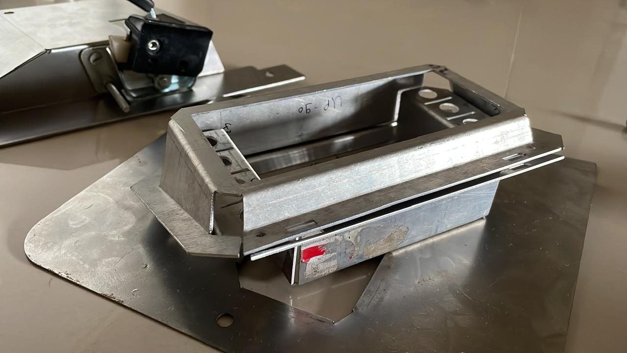 Aluminium speedometer casing on a bench