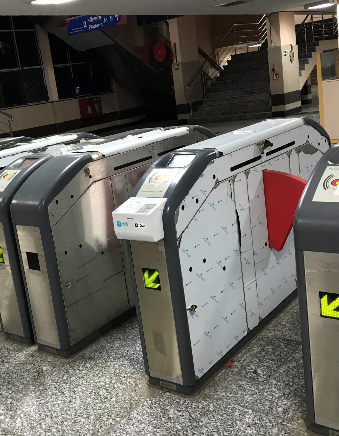 Delhi Metro gates with the housings installed, taped off during commissioning