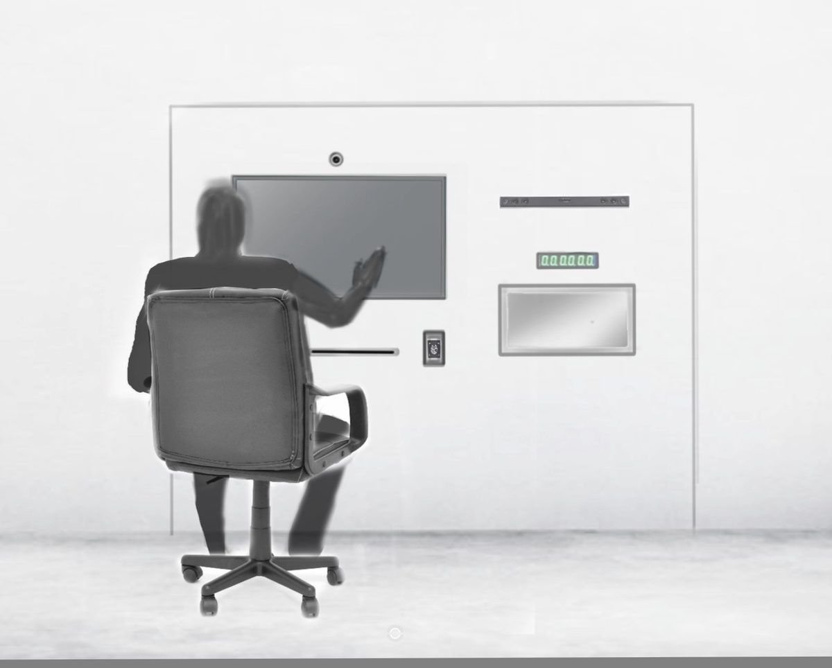 Render of a person seated at a wall with a screen, a slot and a small tray built into it